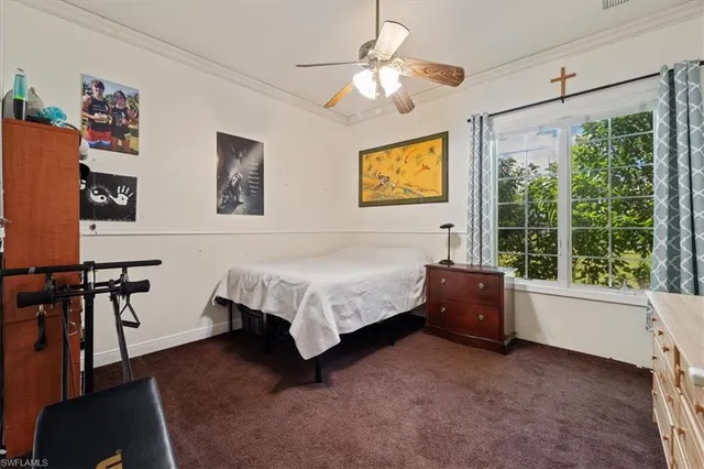 a bed room with a bed and a window