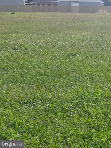 a view of a field with an outdoor space
