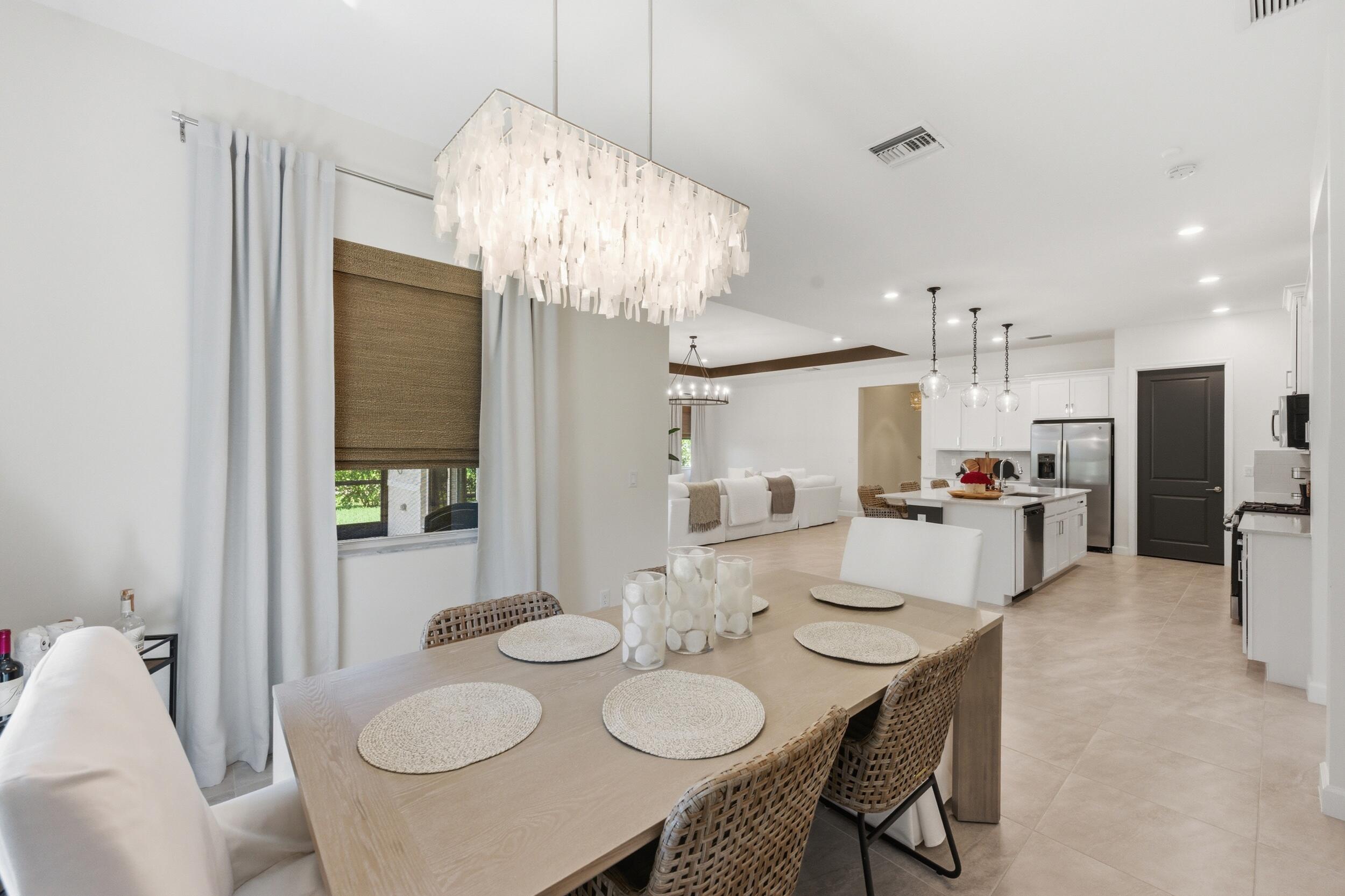 19230 Rolling Acres Road Loxahatchee, FL 33470 - Photo 12 of 58 a view of a dining room and furniture