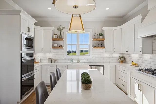 a kitchen with a sink stove and cabinets