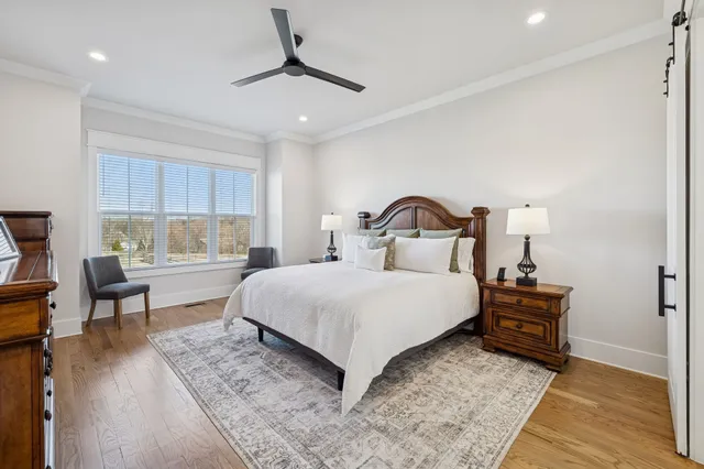 a bathroom with a double vanity sink mirror and bathtub