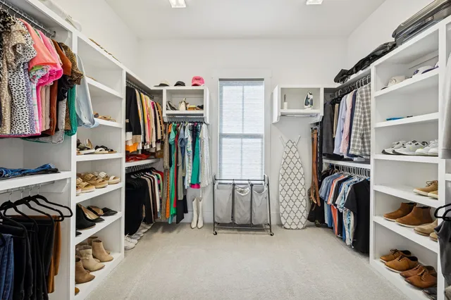 a bedroom with furniture and a window