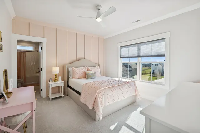 a bedroom with a bed and a table in it