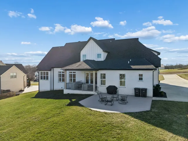 an aerial view of a house with a ocean view