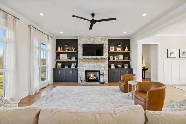 a kitchen with a sink cabinets and wooden floor