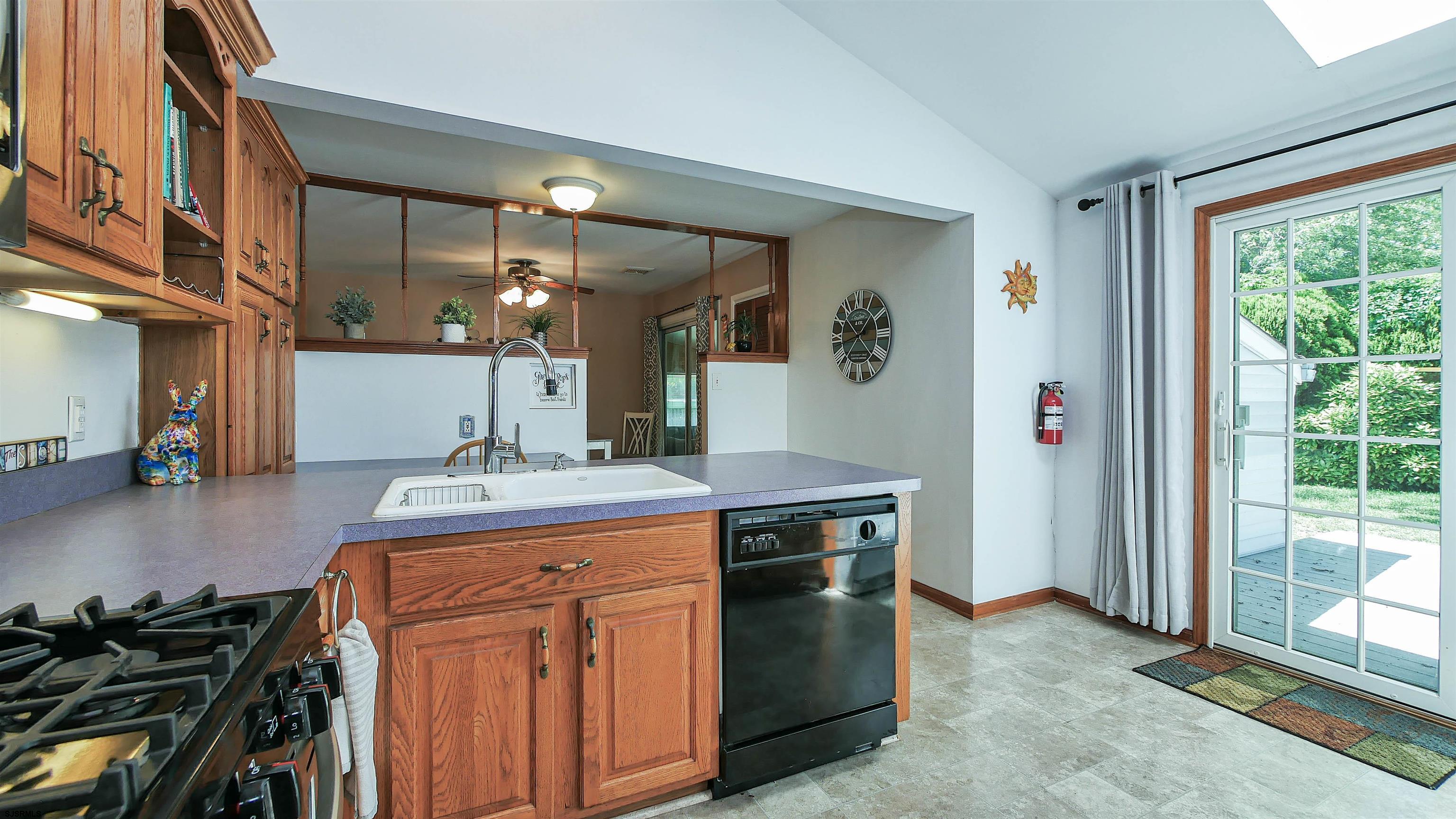 8 Malvern Road Somers Point, NJ 08244 - Photo 11 of 31 a kitchen with a sink and cabinets