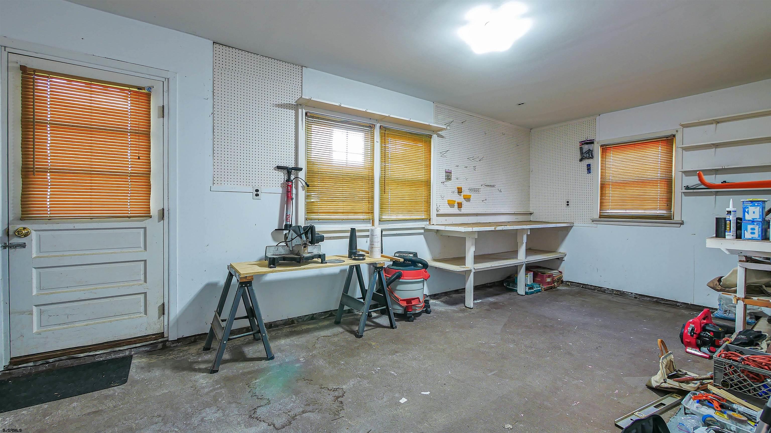 8 Malvern Road Somers Point, NJ 08244 - Photo 23 of 31 a view of a workspace with furniture and a window