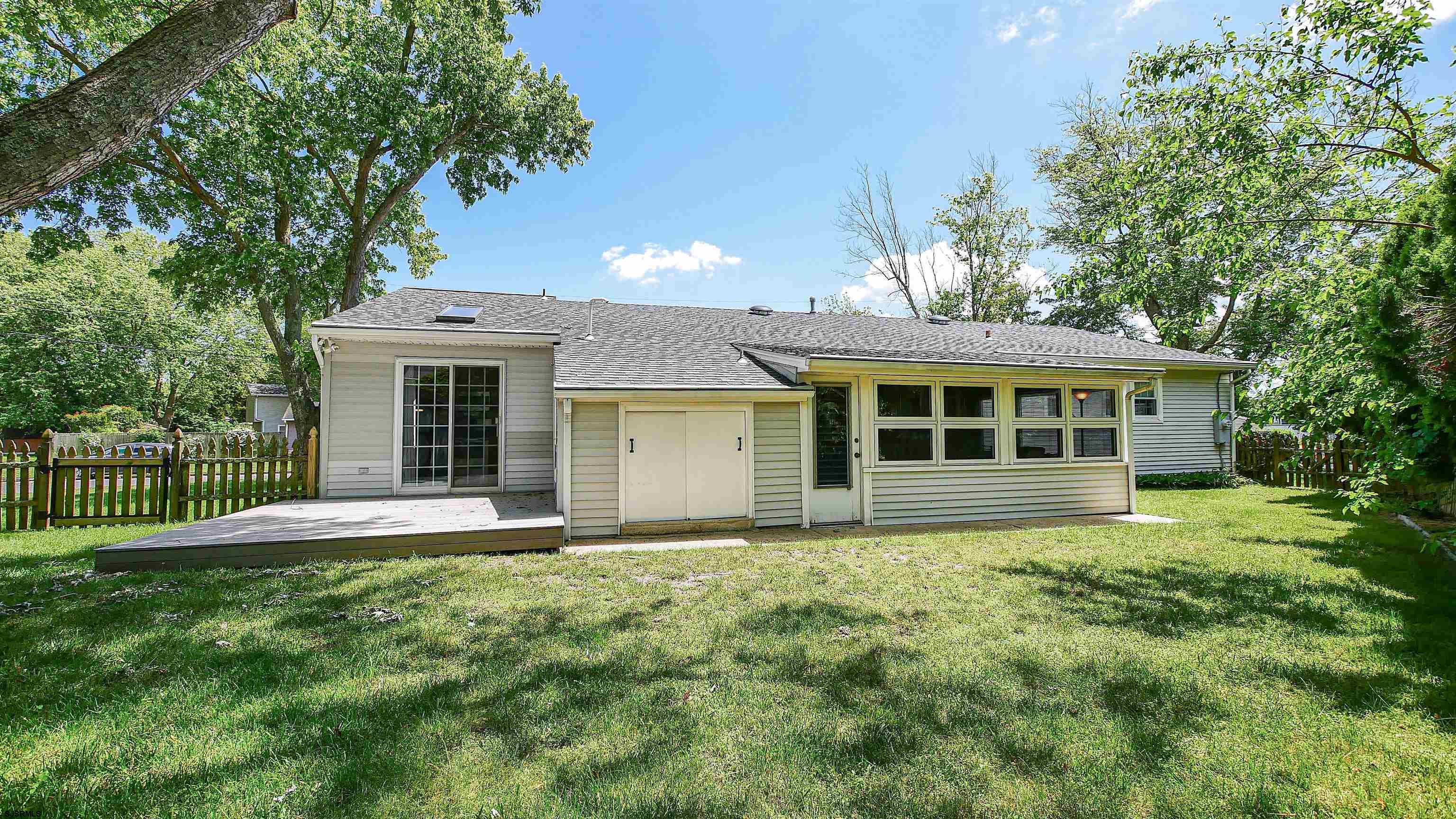 8 Malvern Road Somers Point, NJ 08244 - Photo 25 of 31 a front view of a house with a yard and trees