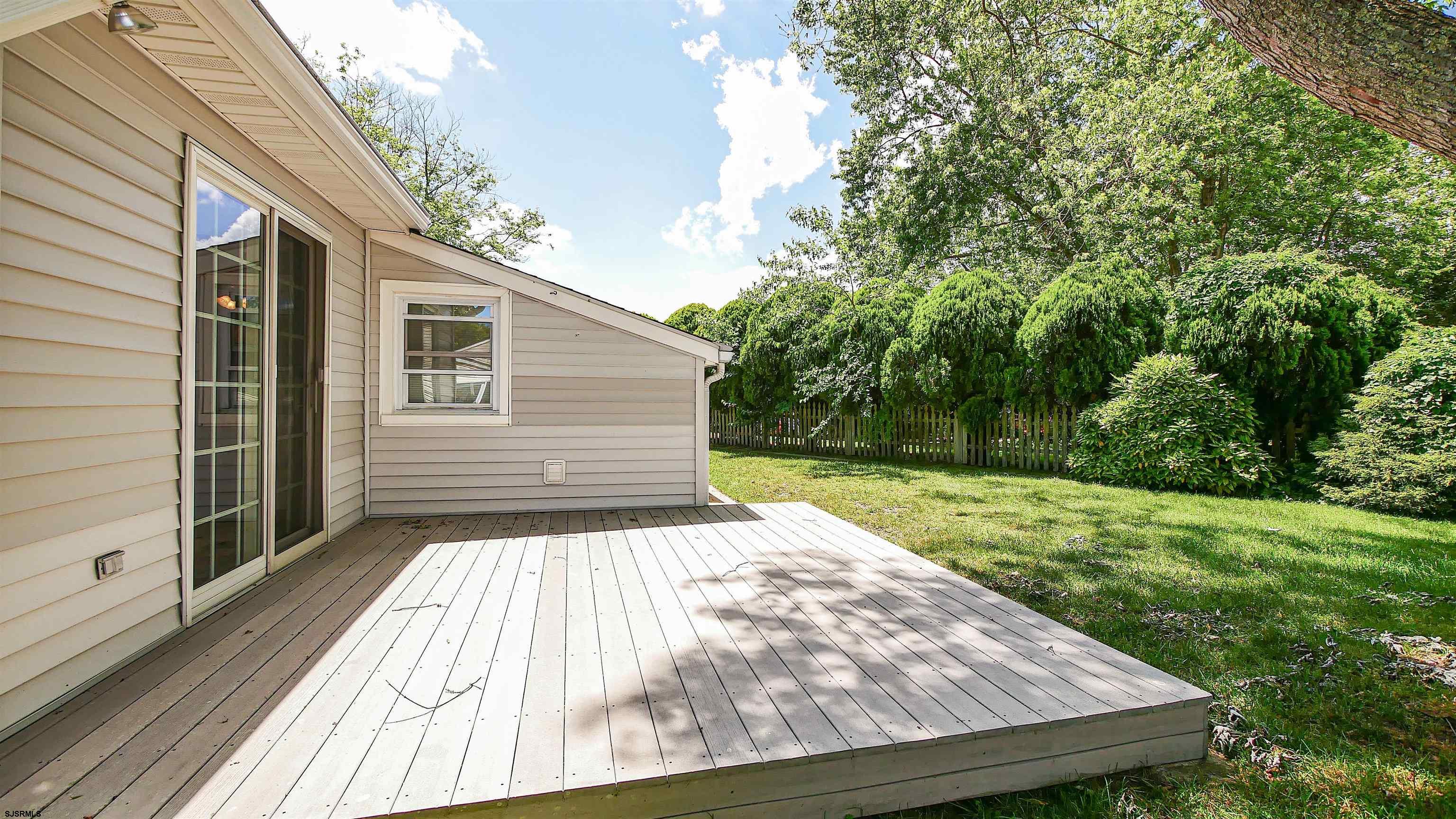 8 Malvern Road Somers Point, NJ 08244 - Photo 26 of 31 a view of backyard with a deck and a garden