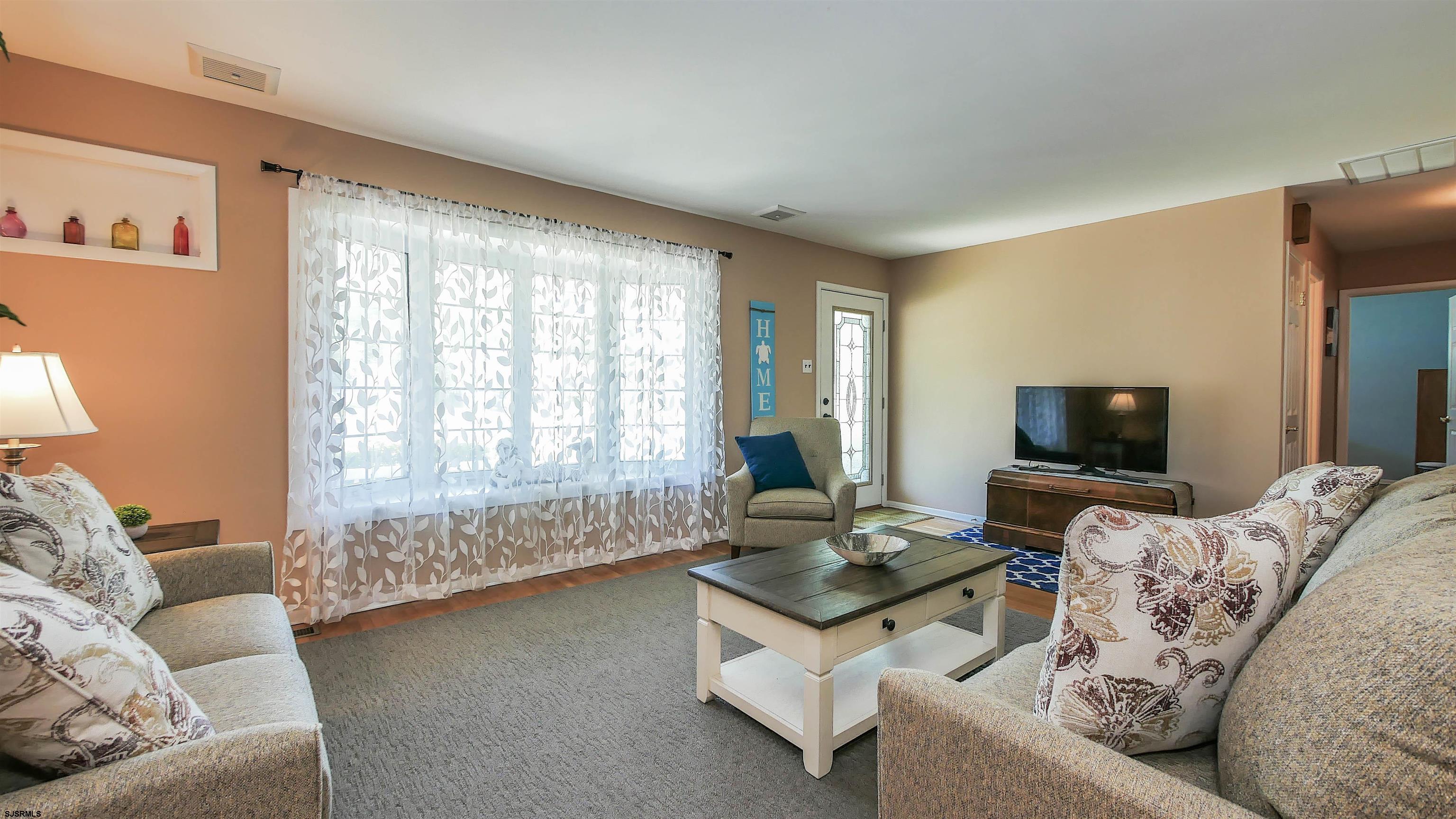8 Malvern Road Somers Point, NJ 08244 - Photo 5 of 31 a living room with furniture and a flat screen tv