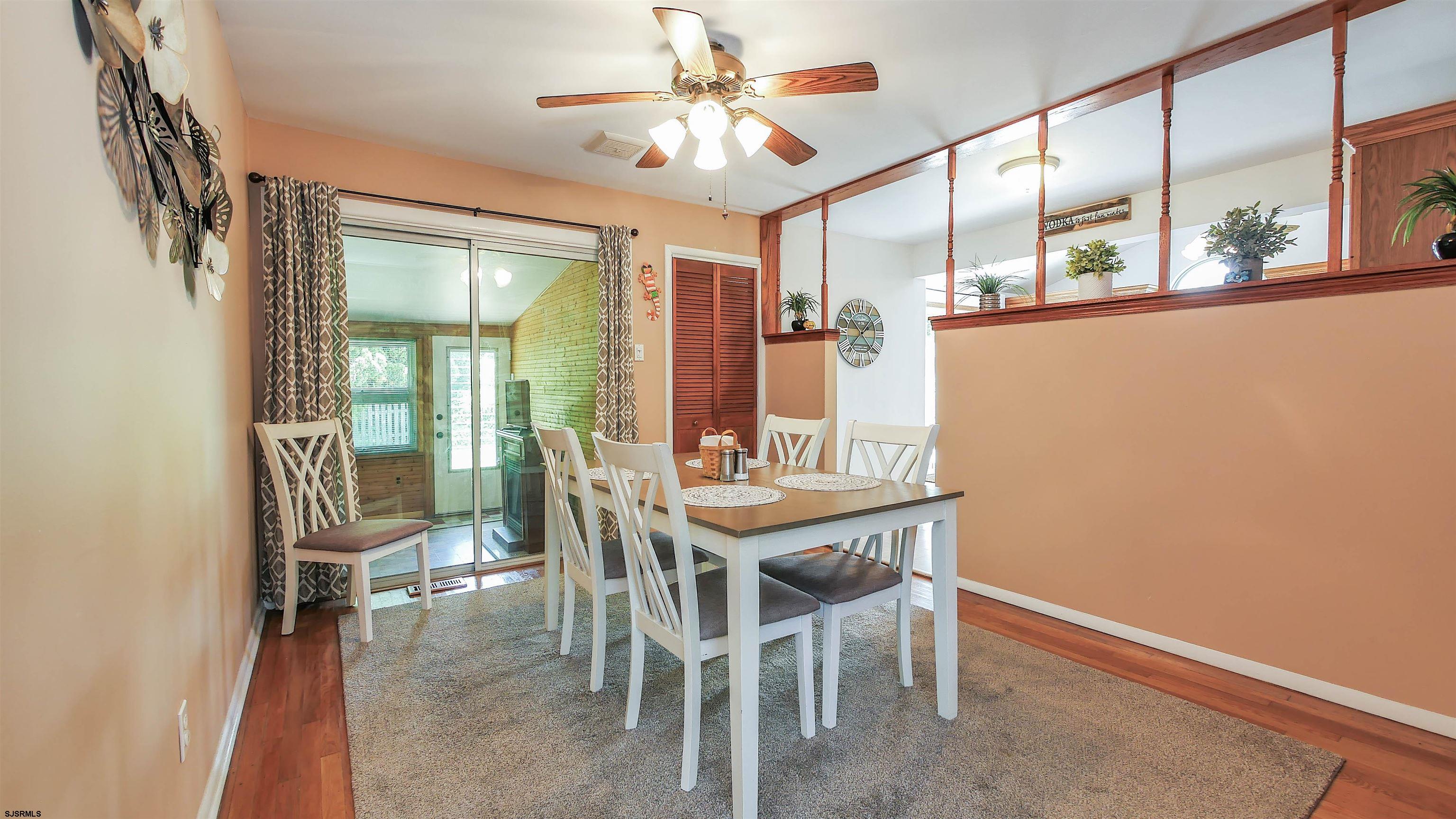 8 Malvern Road Somers Point, NJ 08244 - Photo 6 of 31 a view of a dining room with furniture window and wooden floor