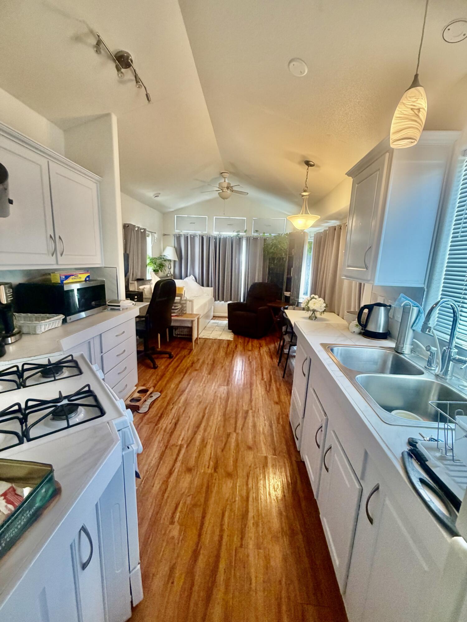 74711 Dillon Road, Unit 264 Desert Hot Springs, CA 92241 - Photo 10 of 21 a kitchen with counter top space a sink and appliances