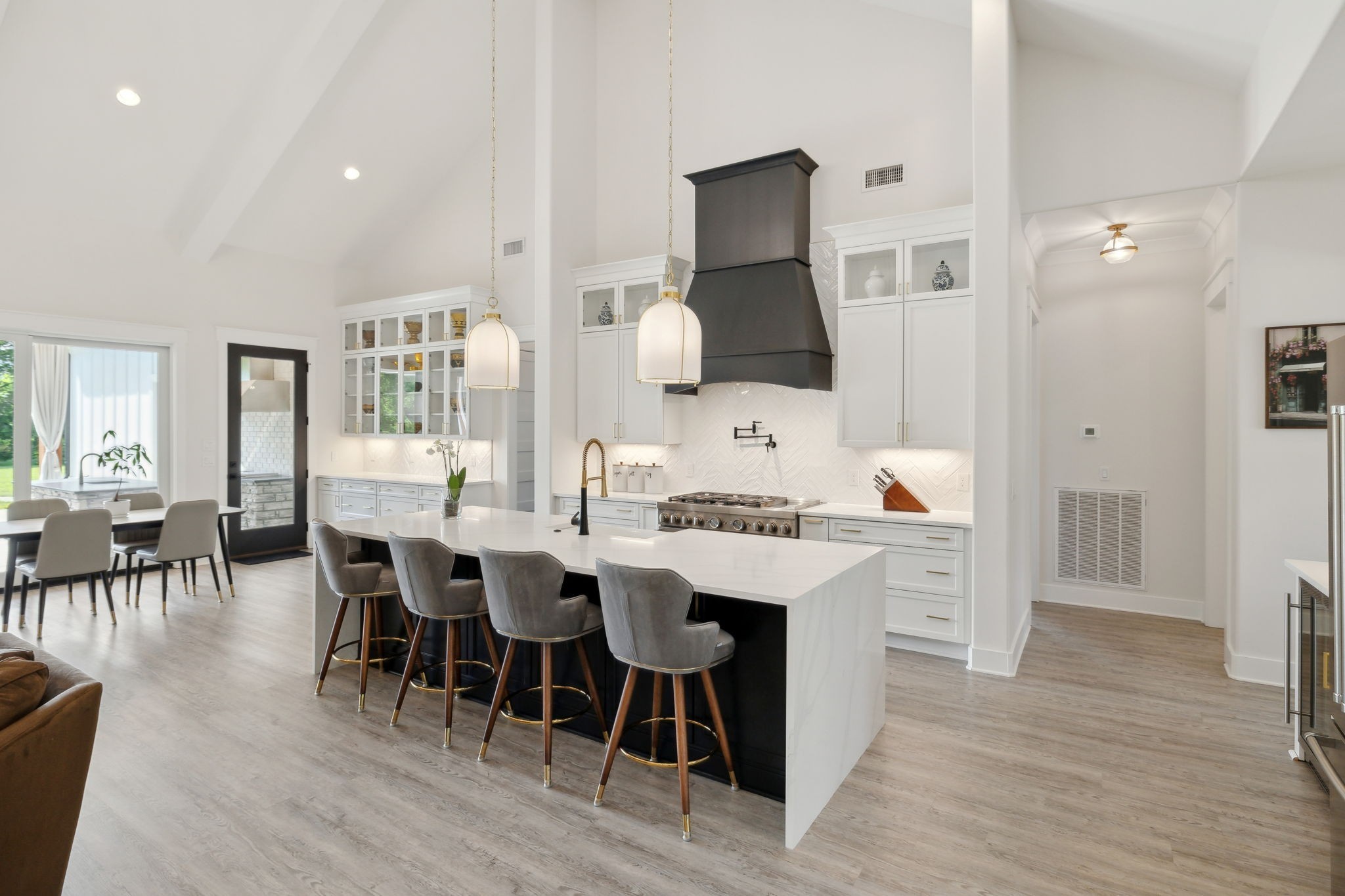 2648 Wilson Overall Road Murfreesboro, TN 37127 - Photo 43 of 92 a kitchen with stainless steel appliances kitchen island granite countertop a table chairs sink and wooden floor