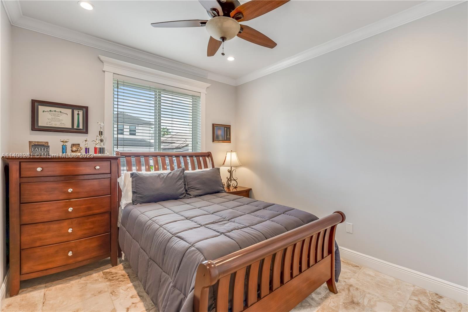 13151 Northwest 7th Street Miami, FL 33172 - Photo 33 of 48 a bedroom with a bed and a dresser