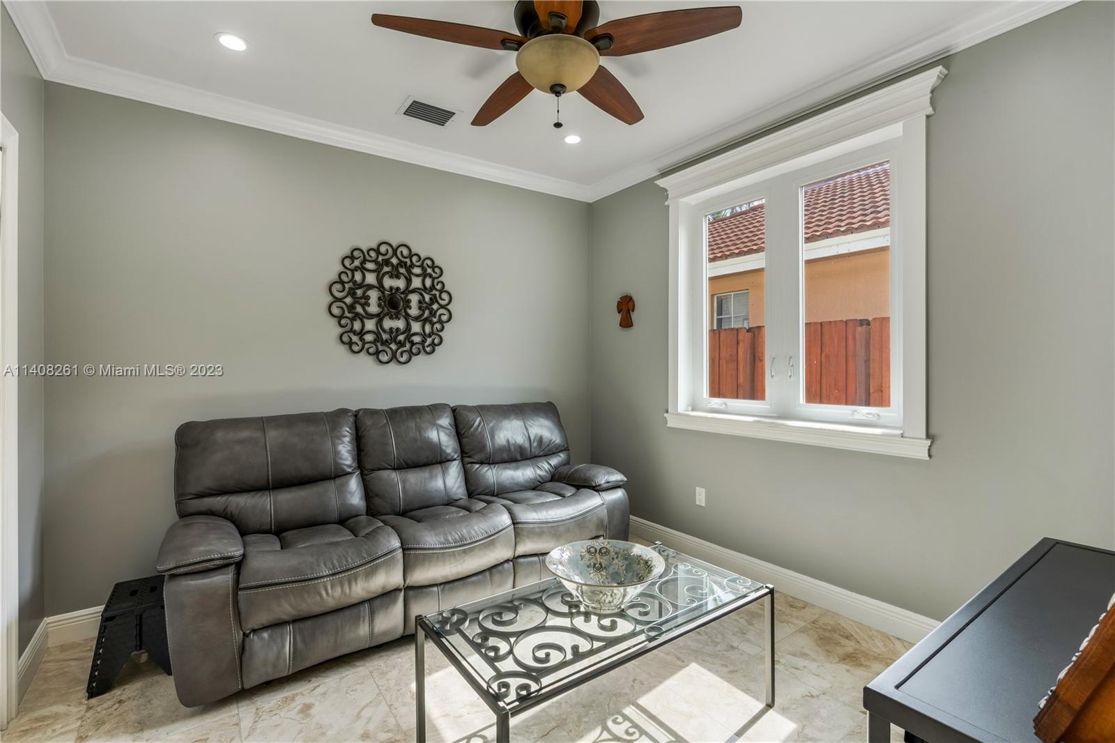 13151 Northwest 7th Street Miami, FL 33172 - Photo 34 of 48 a living room with furniture and a window