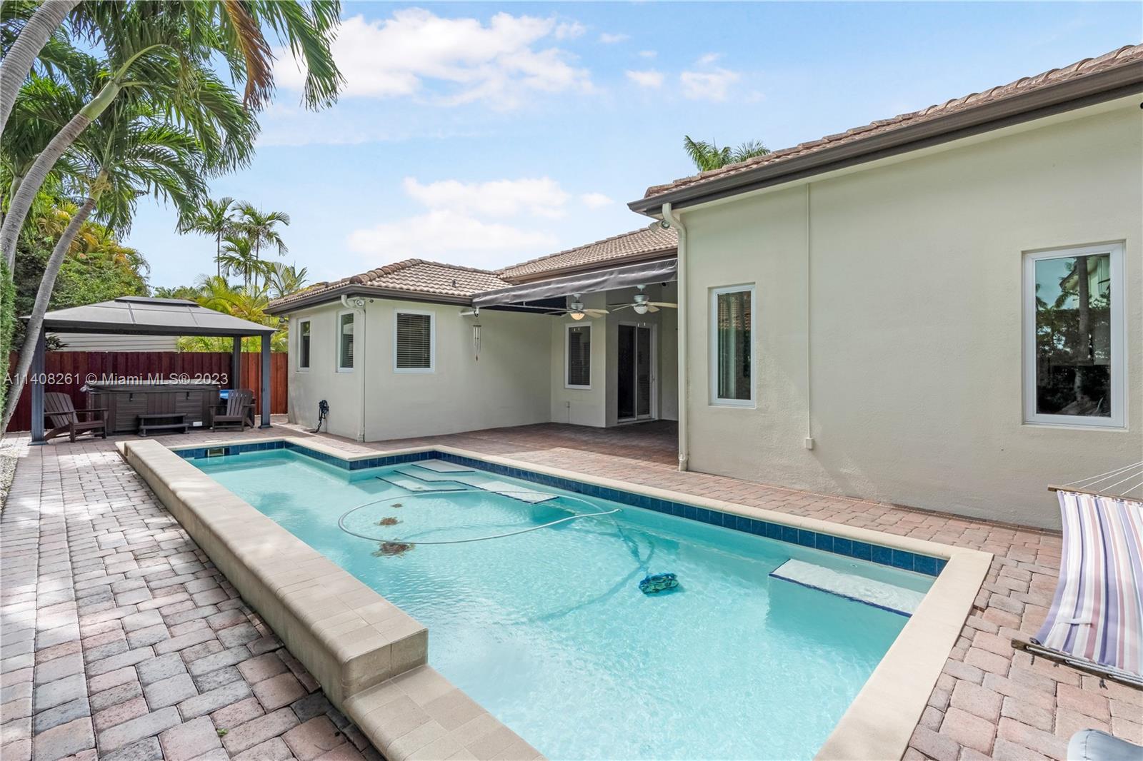 13151 Northwest 7th Street Miami, FL 33172 - Photo 44 of 48 a front view of a house with garden