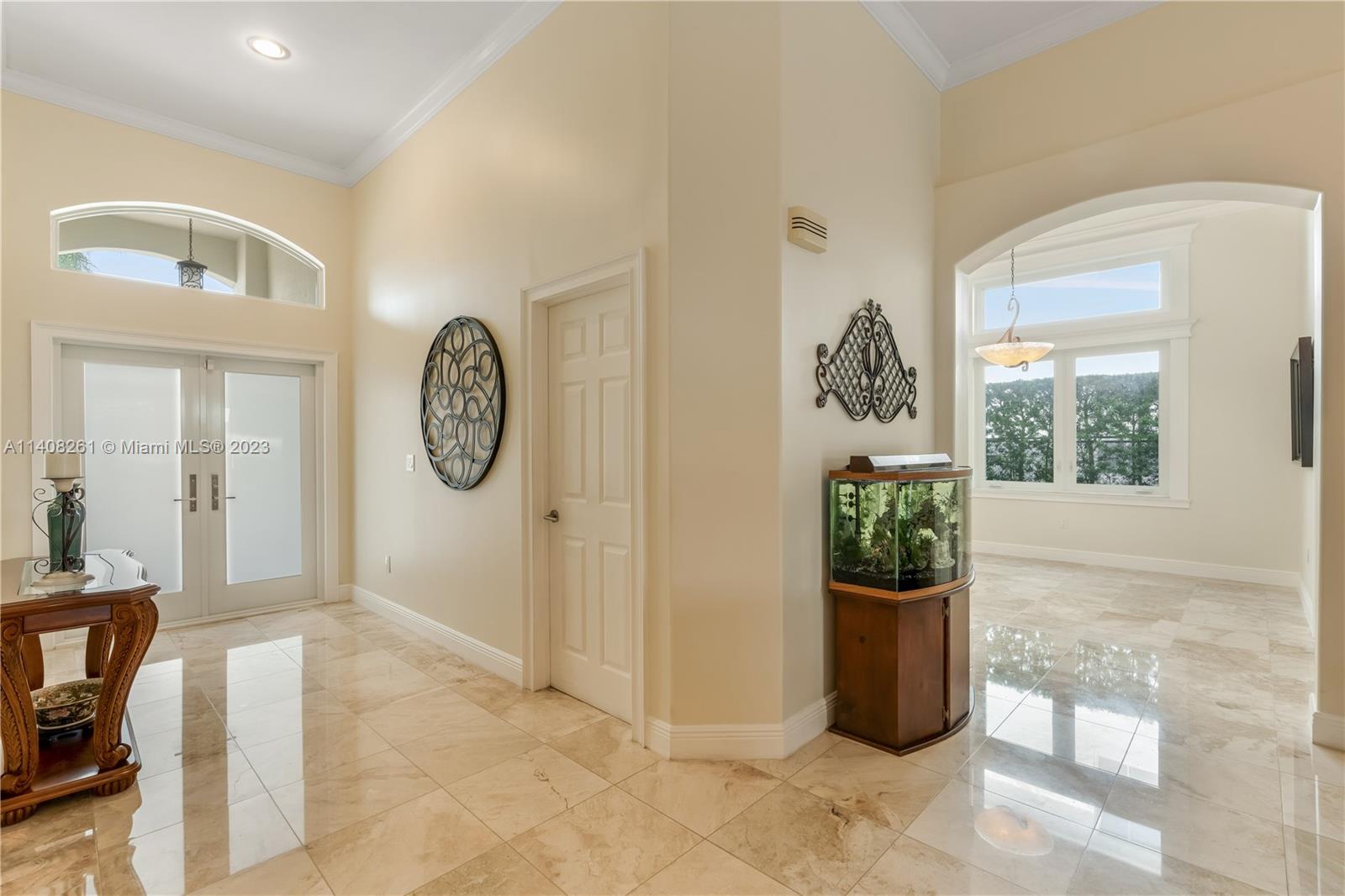 13151 Northwest 7th Street Miami, FL 33172 - Photo 7 of 48 a view of a hallway with windows