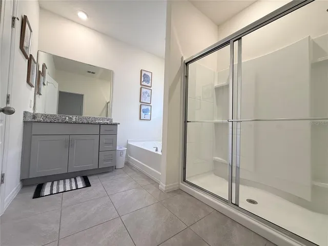 a bedroom with a bed and a television in it