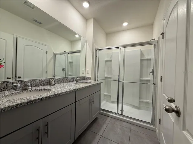 a bedroom with a bed and chair