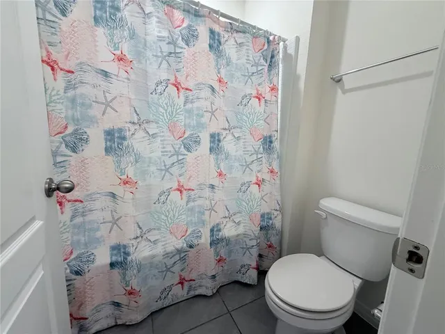 a view of a patio with a table and chairs