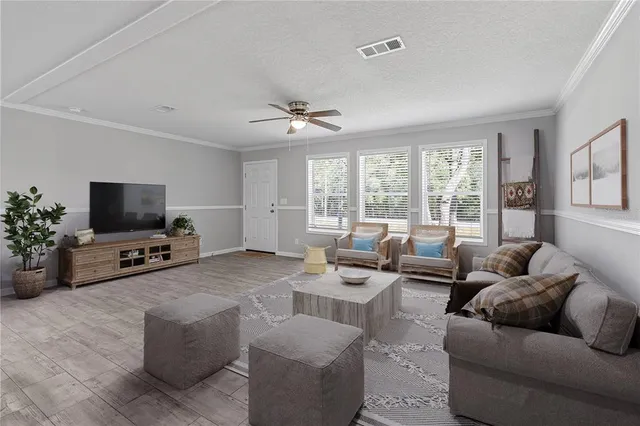 a kitchen with stainless steel appliances a stove a sink refrigerator and a microwave