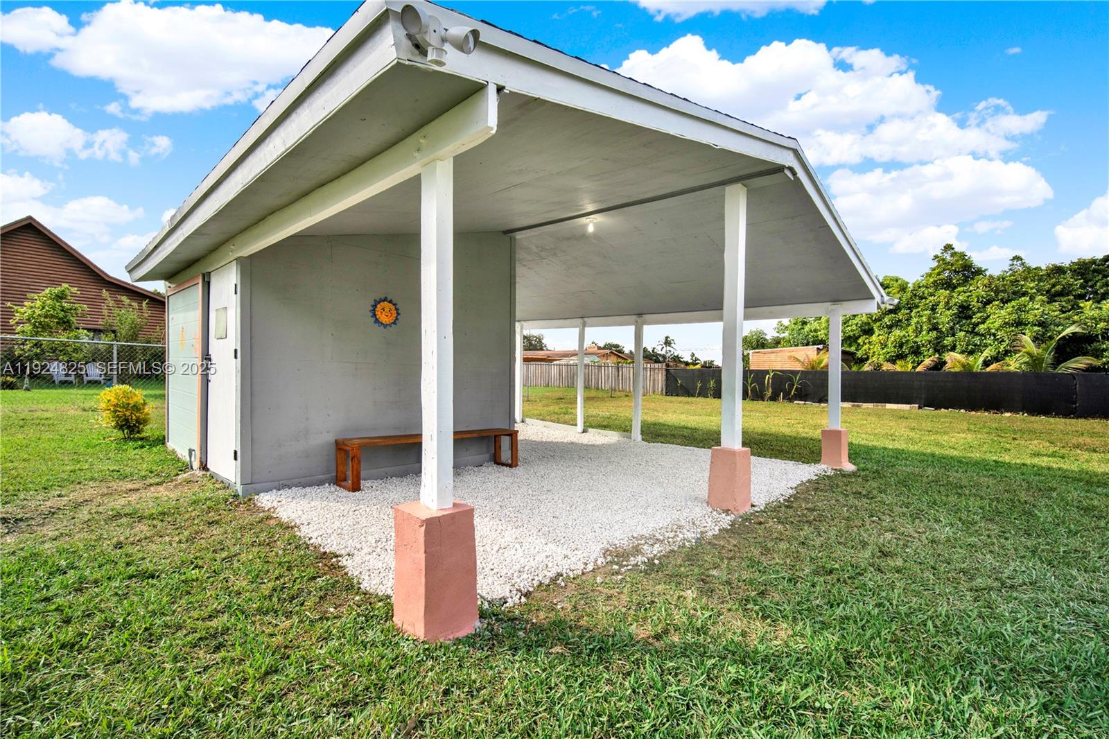 22820 Southwest 179th Place Miami, FL 33170 - Photo 15 of 56 a view of a house with backyard and porch
