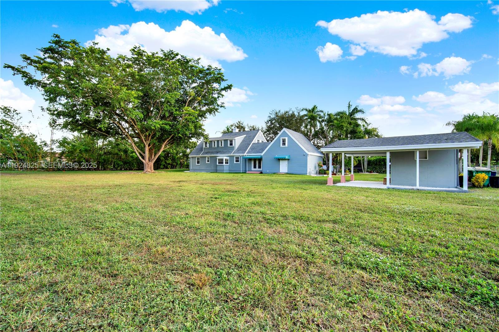 22820 Southwest 179th Place Miami, FL 33170 - Photo 17 of 56 a view of house with a garden