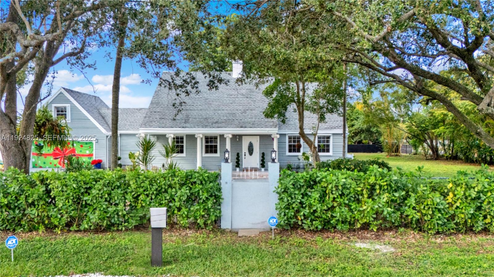 22820 Southwest 179th Place Miami, FL 33170 - Photo 3 of 56 a front view of house with yard and green space