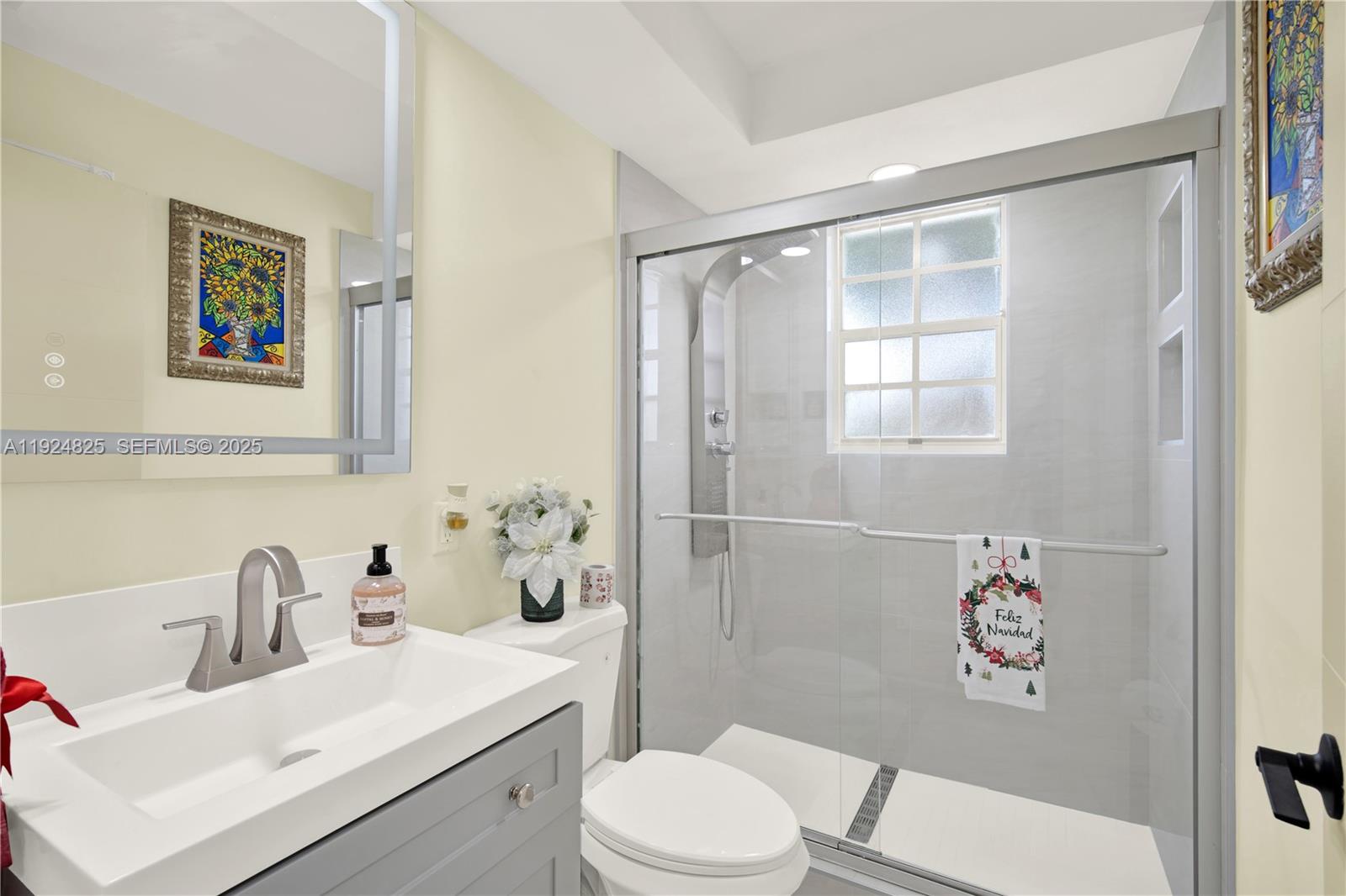 22820 Southwest 179th Place Miami, FL 33170 - Photo 34 of 56 a bathroom with a sink mirror vanity and toilet