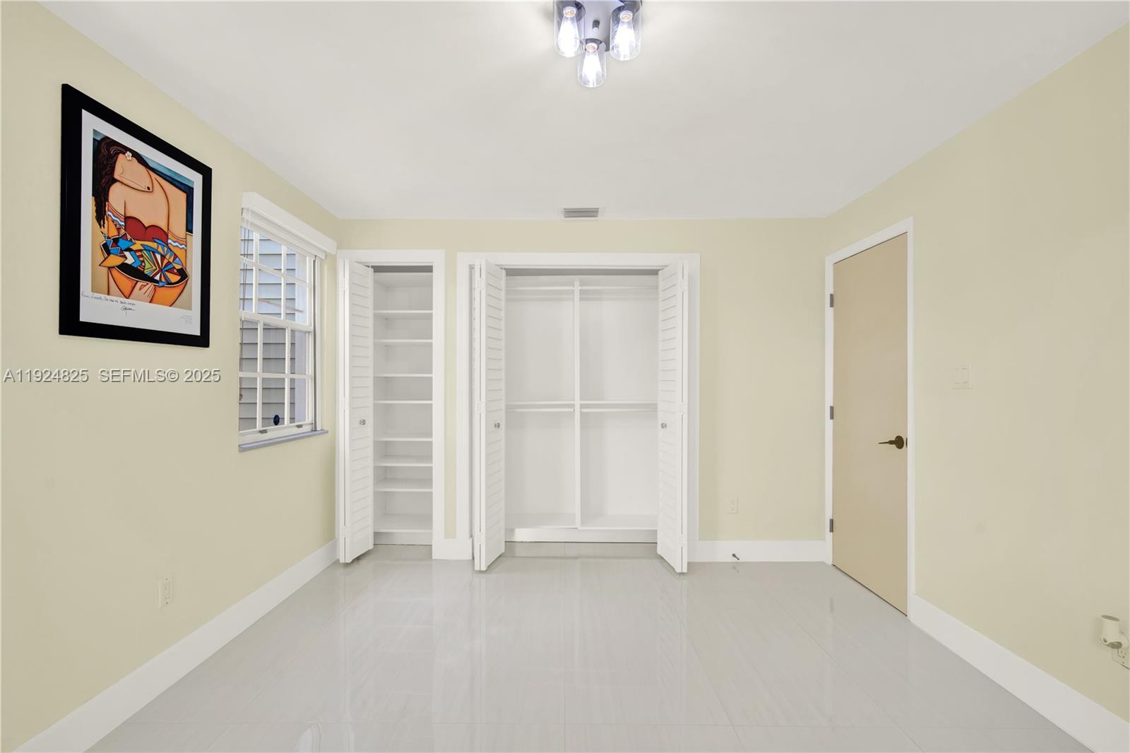 22820 Southwest 179th Place Miami, FL 33170 - Photo 36 of 56 an empty room with windows & cabinet