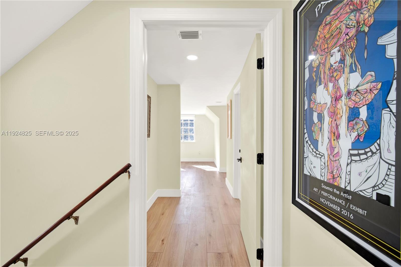 22820 Southwest 179th Place Miami, FL 33170 - Photo 40 of 56 a view of a hallway with wooden floor and staircase