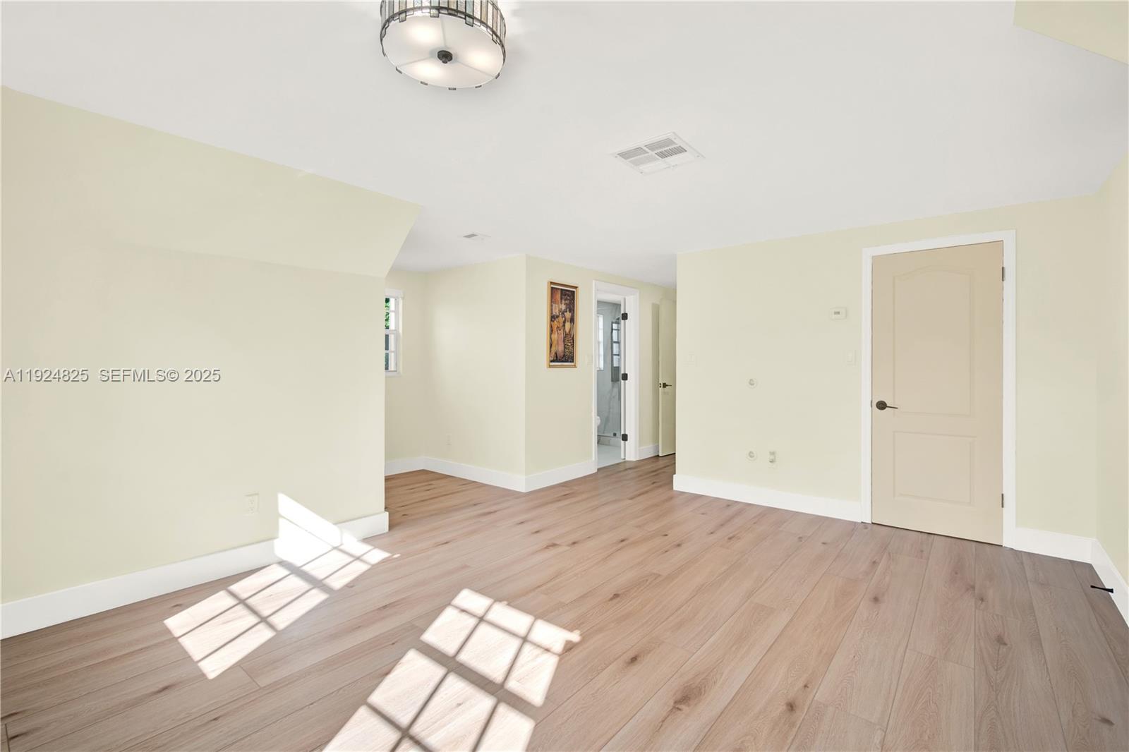 22820 Southwest 179th Place Miami, FL 33170 - Photo 43 of 56 a view of empty room with wooden floor
