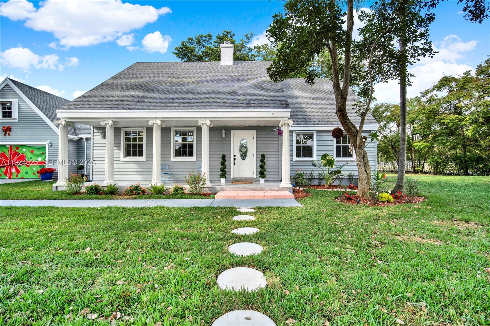 22820 Southwest 179th Place Miami, FL 33170 - Photo 7 of 56 a front view of house with yard and outdoor seating