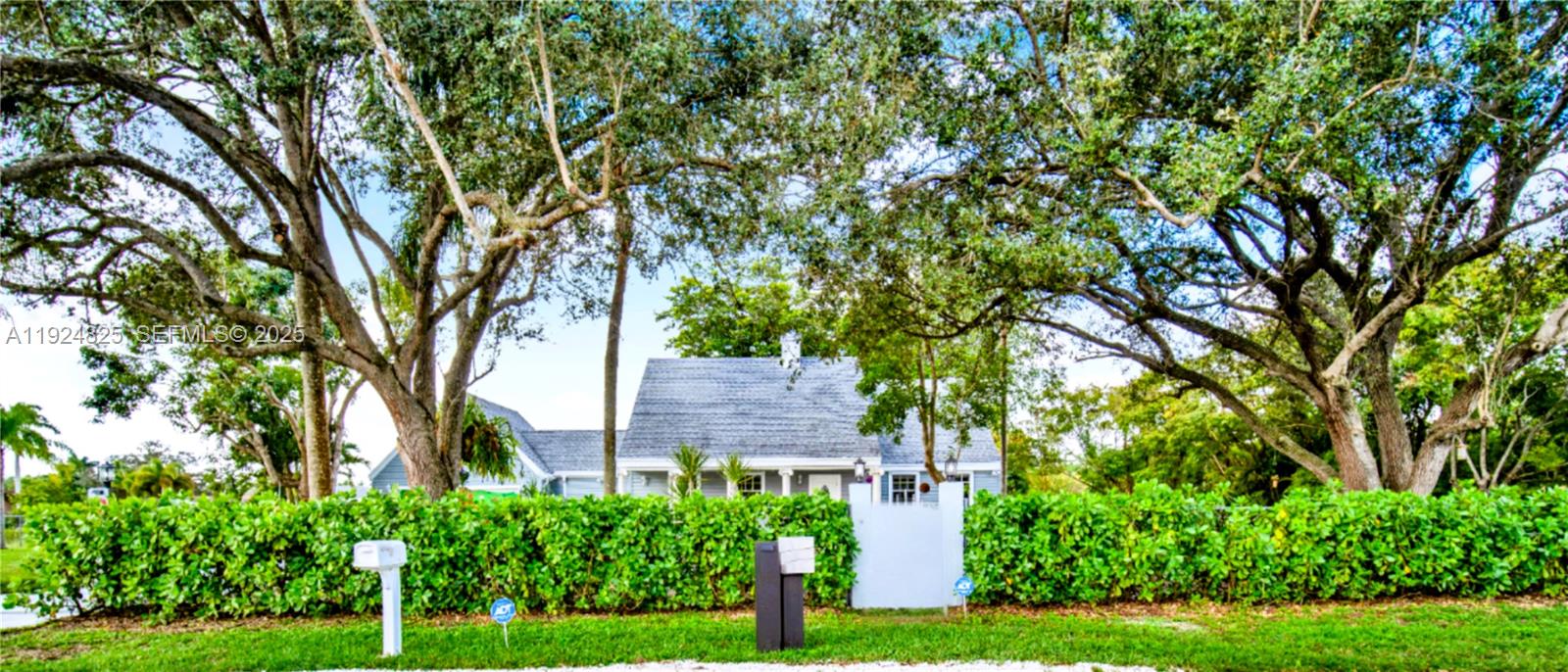 22820 Southwest 179th Place Miami, FL 33170 - Photo 9 of 56 front view of a house with a tree