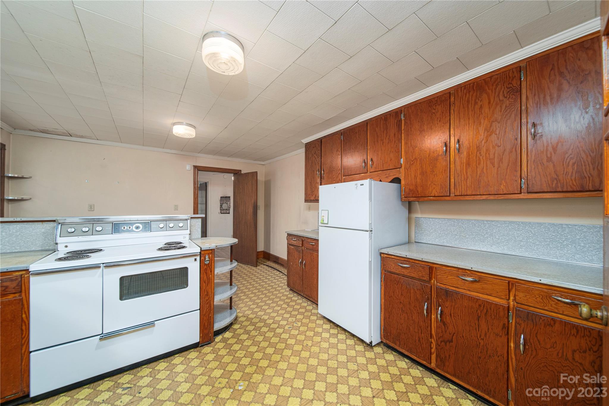 3980 Woodleaf Road Salisbury, NC 28147 - Photo 12 of 34 a kitchen with a stove cabinets and refrigerator