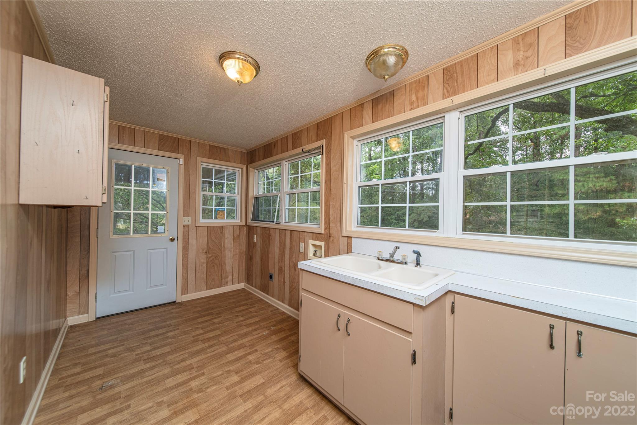 3980 Woodleaf Road Salisbury, NC 28147 - Photo 14 of 34 a utility room with cabinets a bed and a window