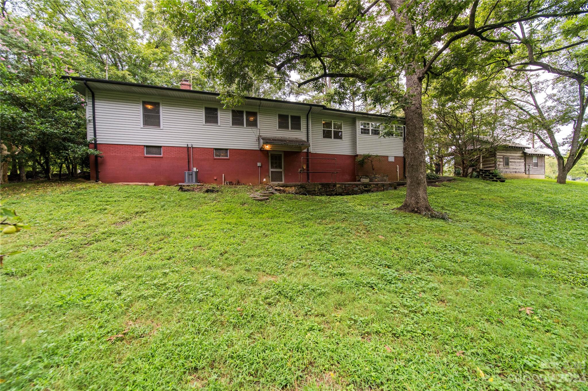 3980 Woodleaf Road Salisbury, NC 28147 - Photo 29 of 34 a view of a yard in front of a house with large trees