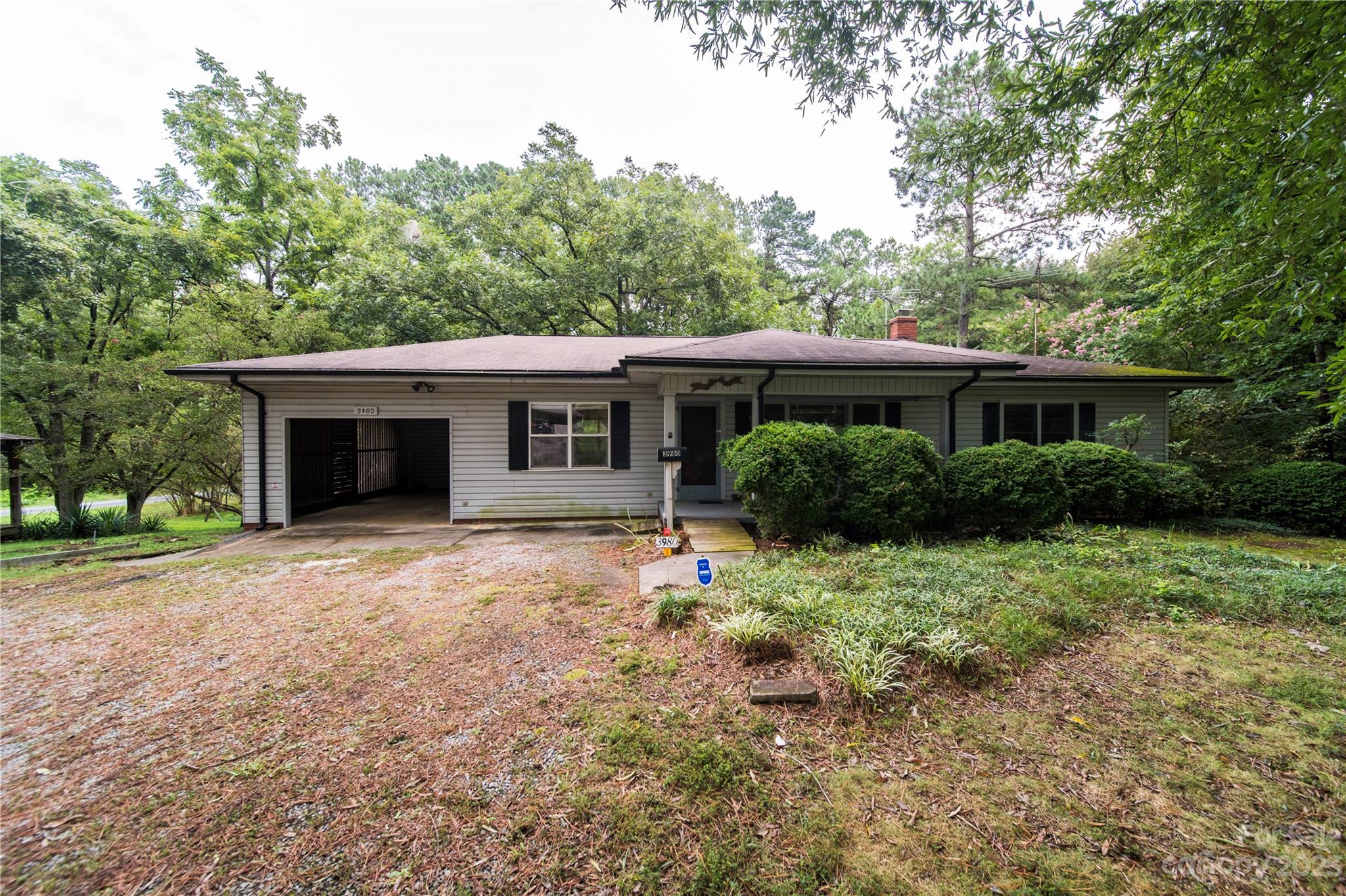 3980 Woodleaf Road Salisbury, NC 28147 - Photo 3 of 34 a front view of a house with a garden and yard