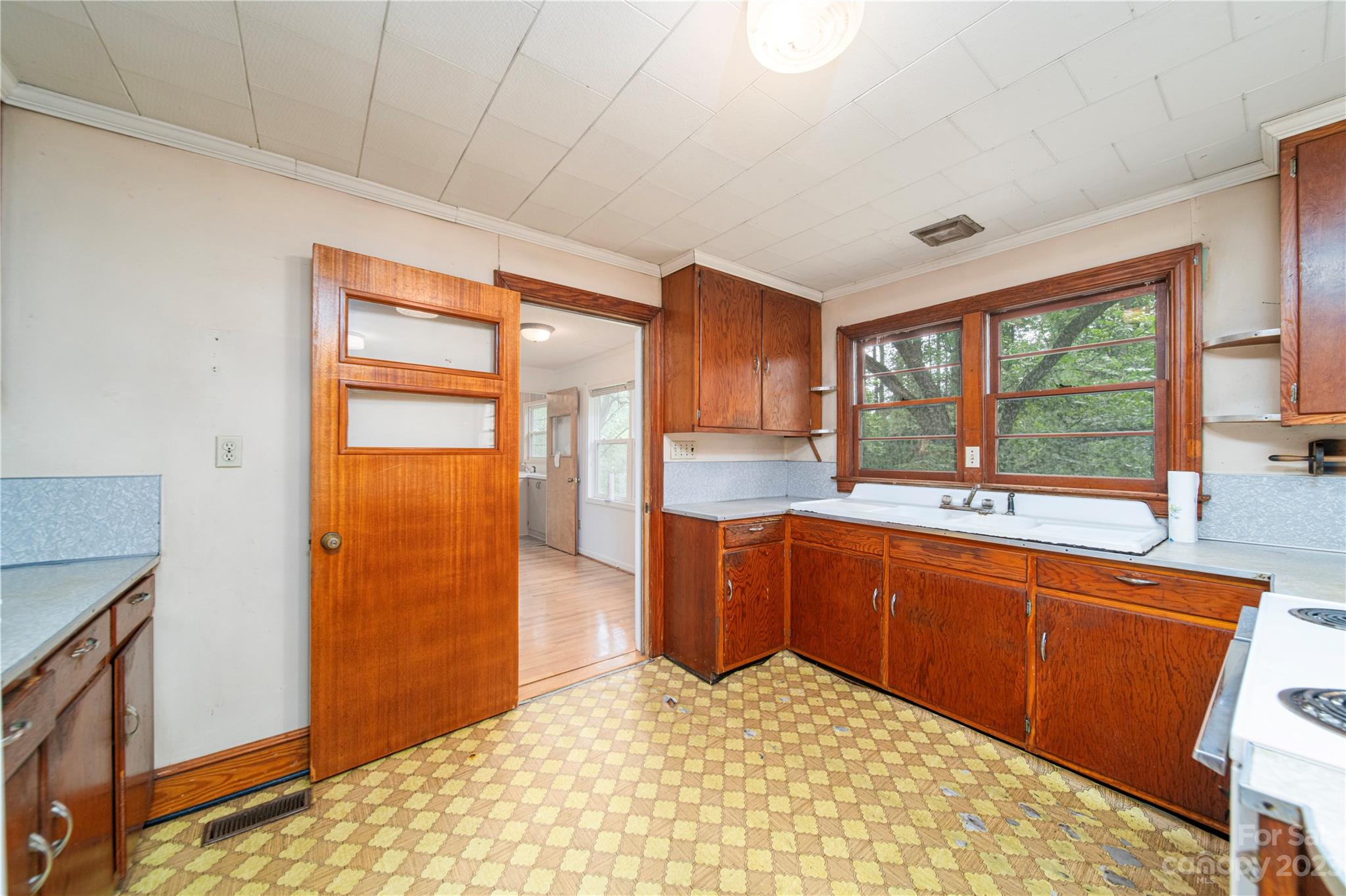 3980 Woodleaf Road Salisbury, NC 28147 - Photo 10 of 34 a kitchen with stainless steel appliances granite countertop a sink and a refrigerator