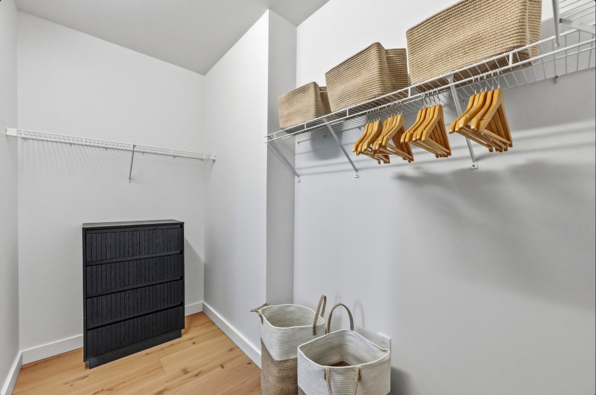 610 Davis Street, Unit 3104 Austin, TX 78701 - Photo 15 of 40 Spacious closet with wood finished floors