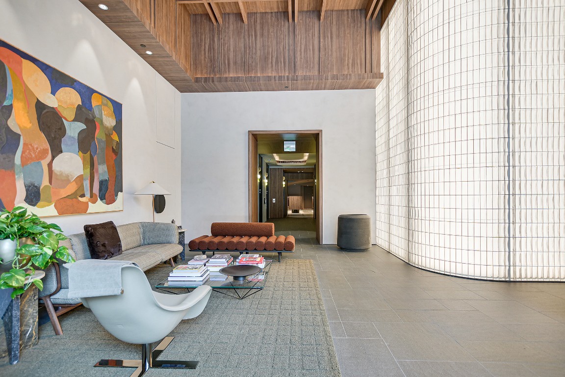 610 Davis Street, Unit 3104 Austin, TX 78701 - Photo 39 of 40 Community lobby featuring a towering ceiling and a wooden ceiling with exposed beams