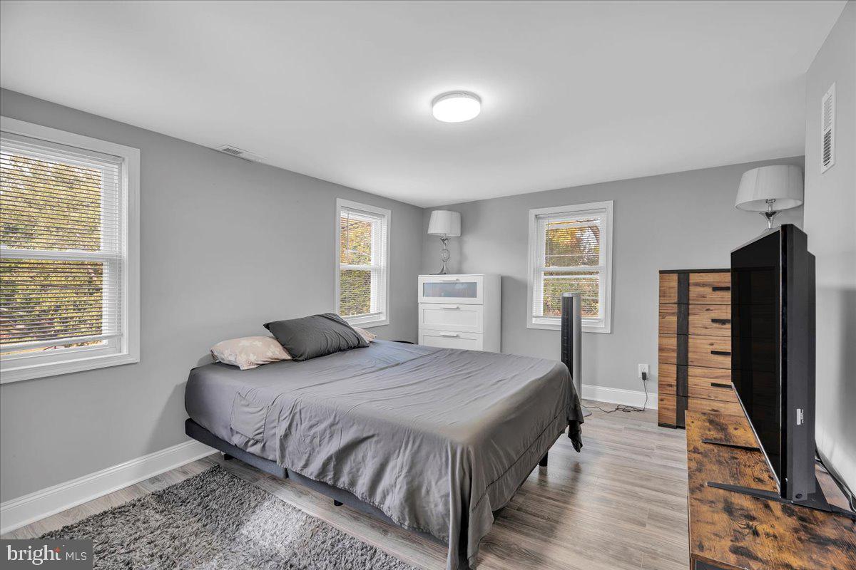 501 Rhoads Avenue Haddonfield, NJ 08033 - Photo 15 of 29 a bedroom with double bed and a flat tv screen