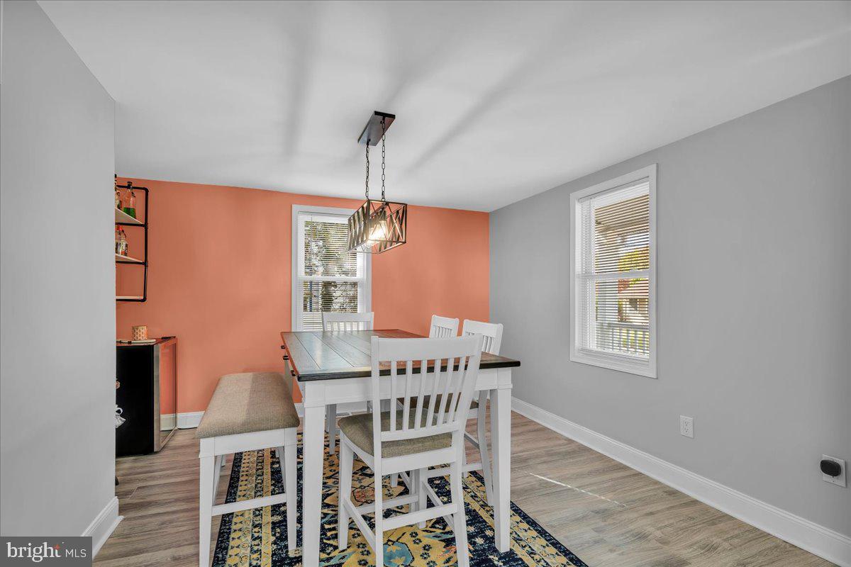 501 Rhoads Avenue Haddonfield, NJ 08033 - Photo 6 of 29 a view of a dining room with furniture and chandelier