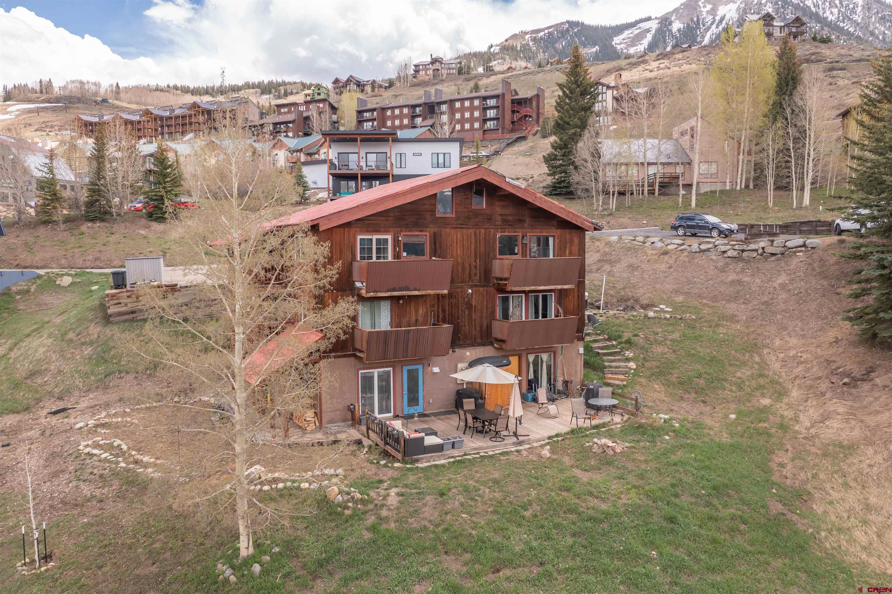 31 Castle Road, Unit 1 Crested Butte, CO 81225 - Photo 13 of 17 a view of a house with a yard