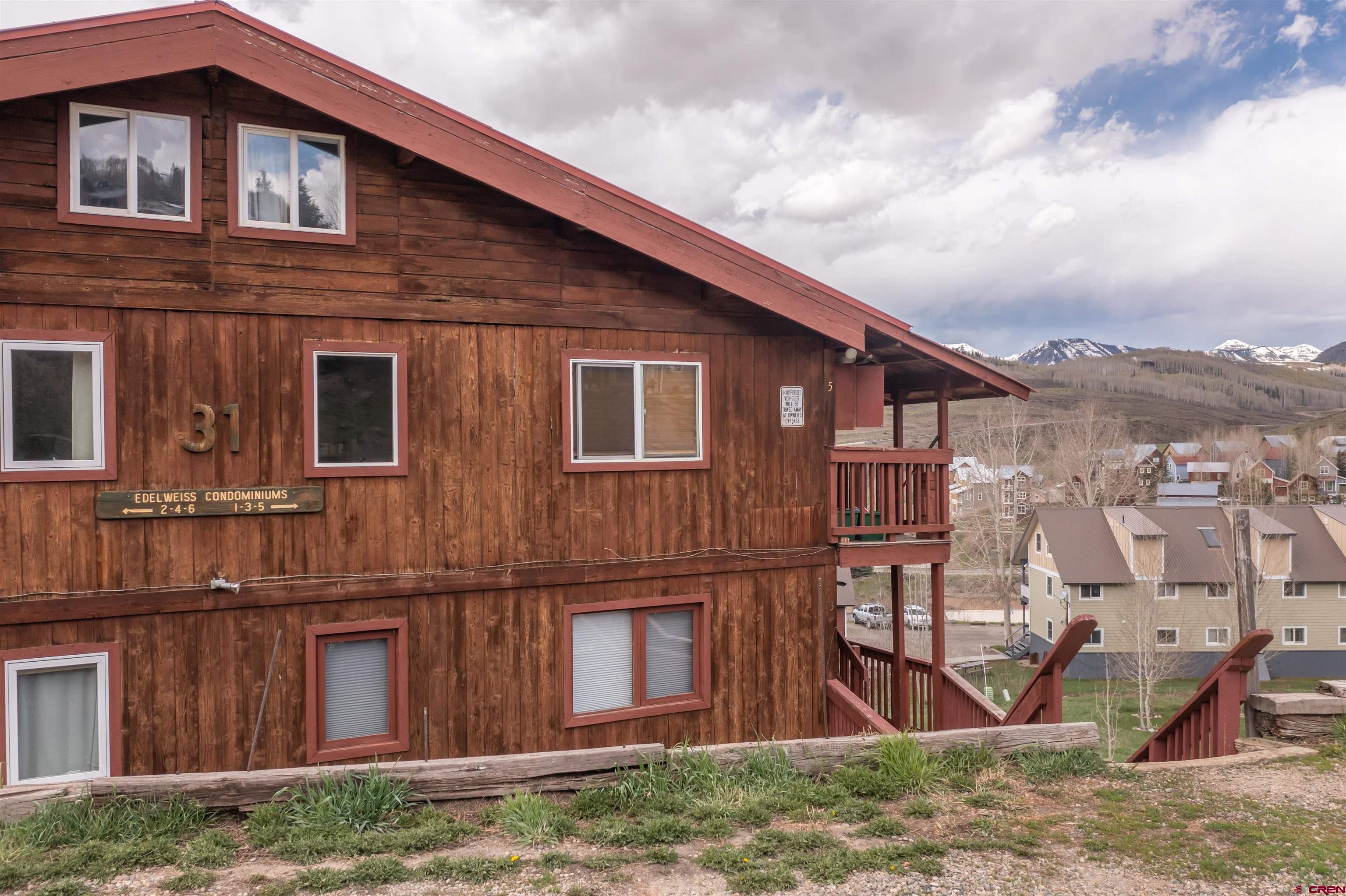 31 Castle Road, Unit 1 Crested Butte, CO 81225 - Photo 17 of 17 a view of a house with wooden fence