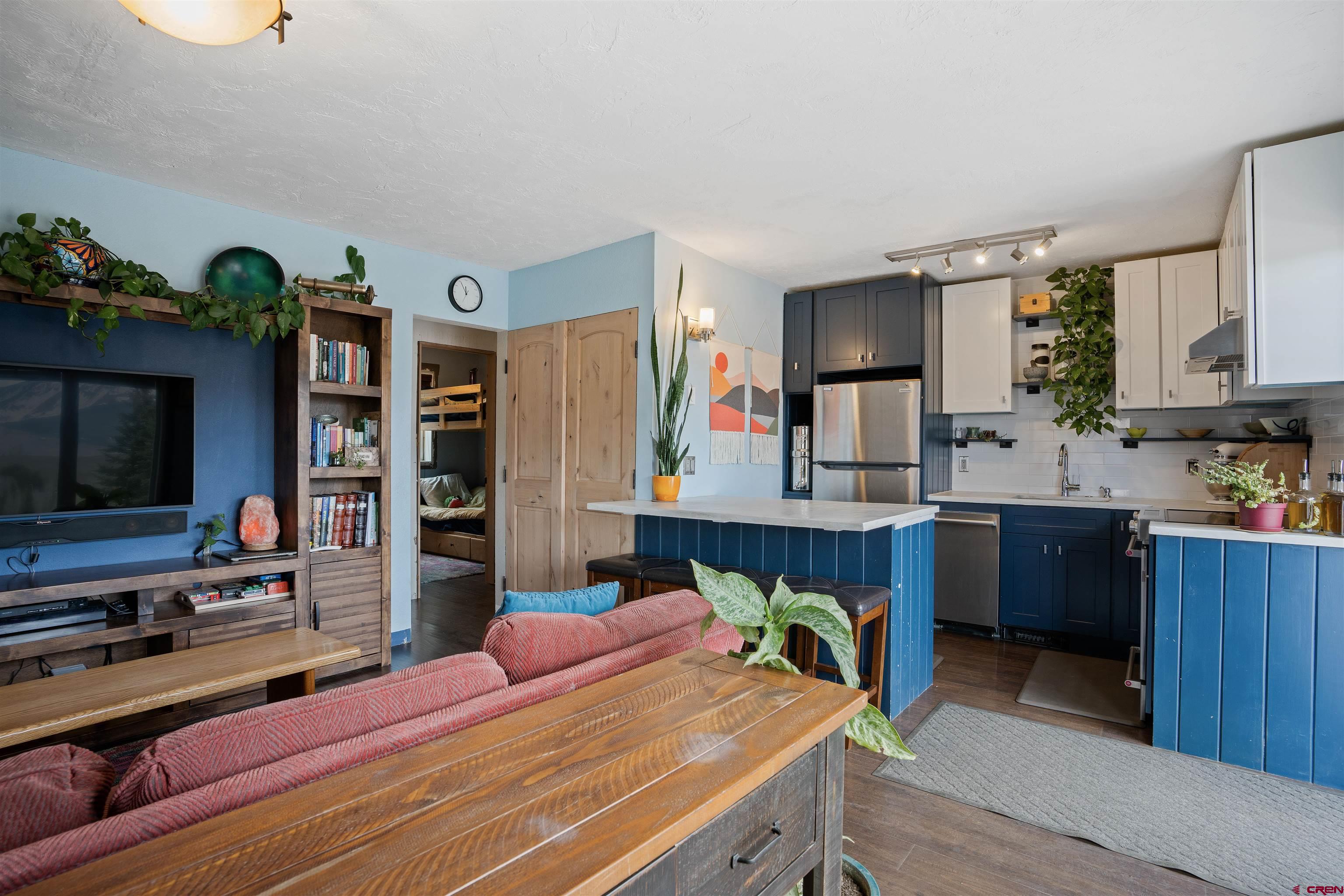 31 Castle Road, Unit 1 Crested Butte, CO 81225 - Photo 6 of 17 a bedroom with a bed window and a television