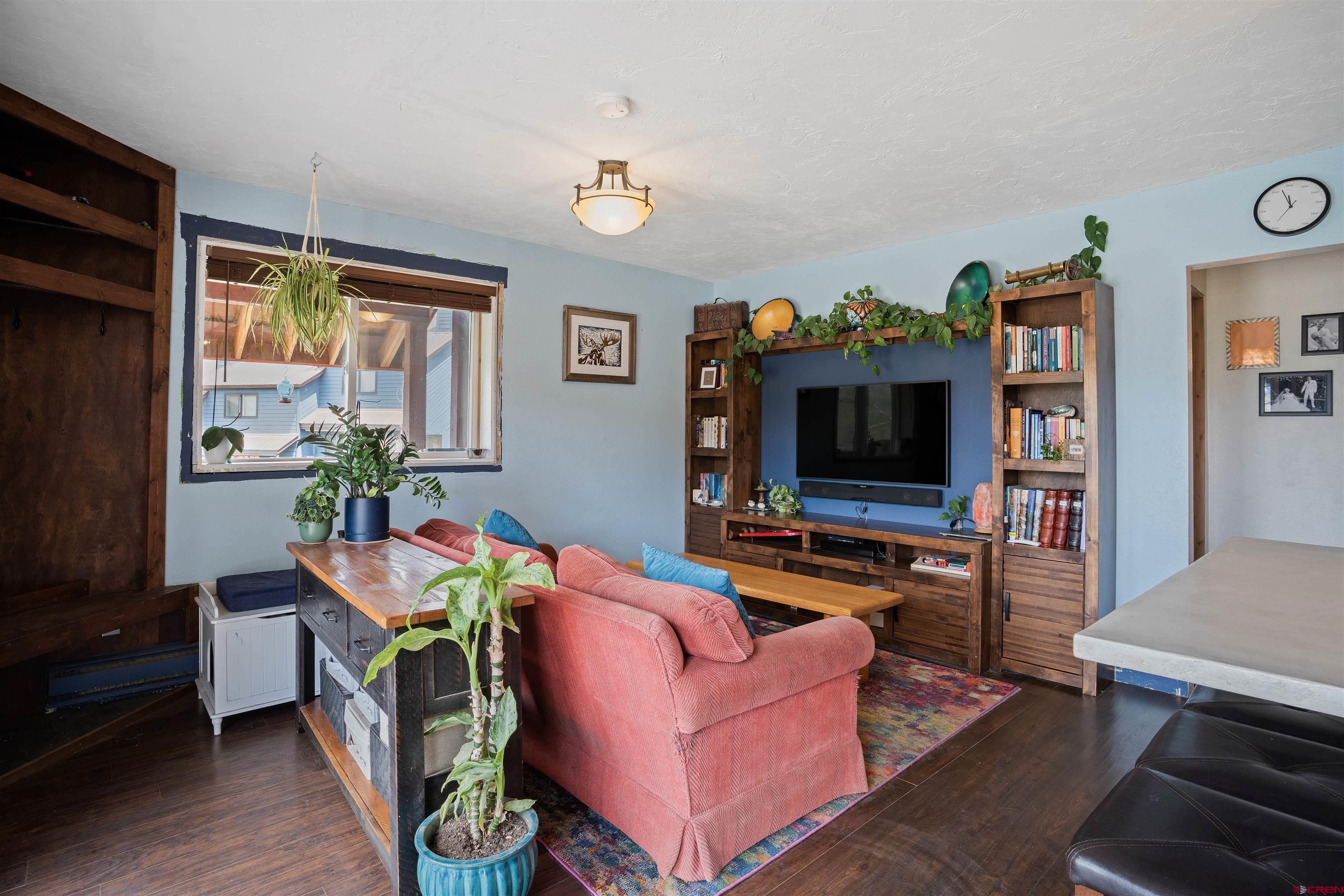 31 Castle Road, Unit 1 Crested Butte, CO 81225 - Photo 7 of 17 a living room with furniture and a flat screen tv