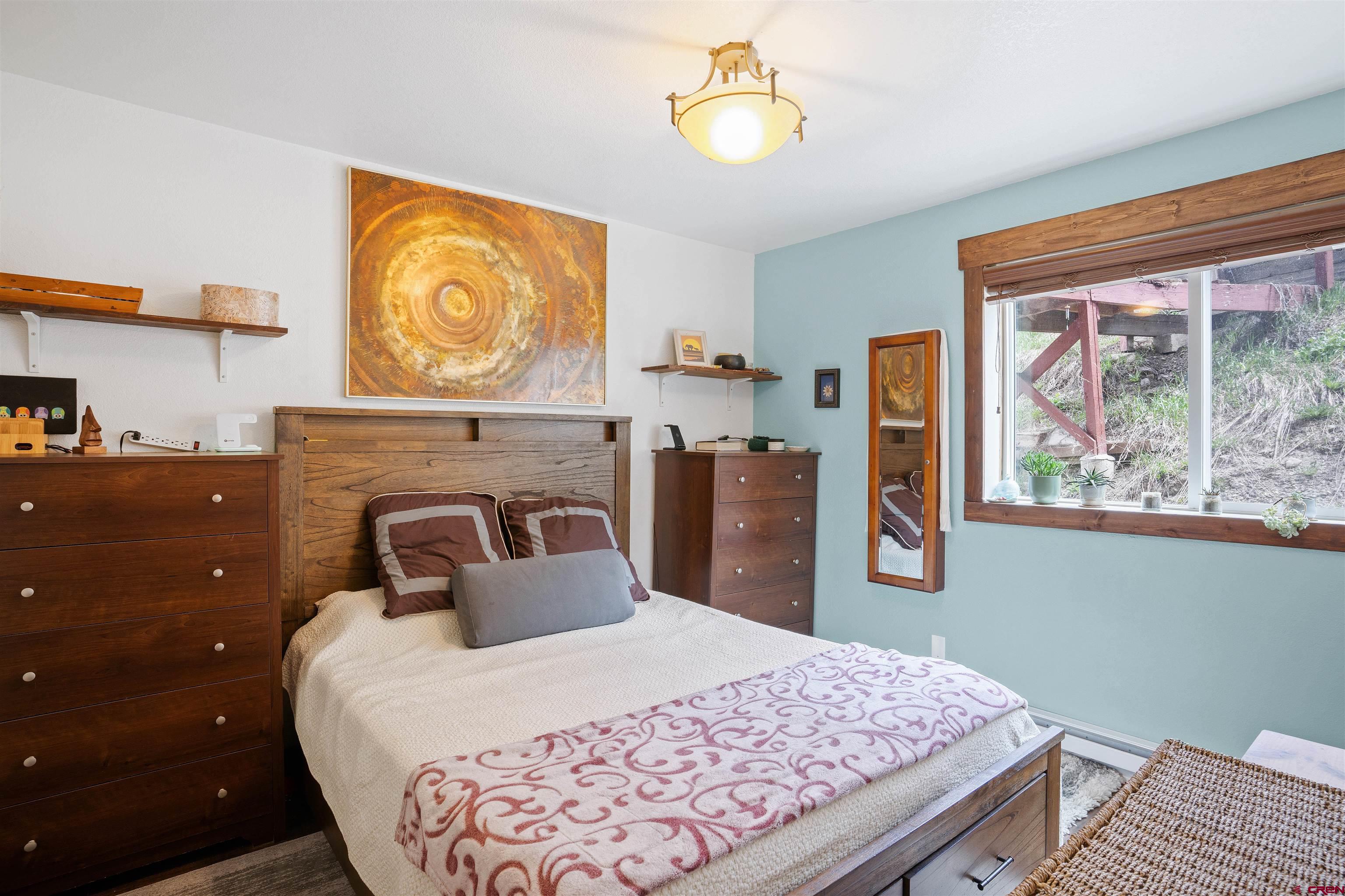 31 Castle Road, Unit 1 Crested Butte, CO 81225 - Photo 8 of 17 a bedroom with a bed and a window