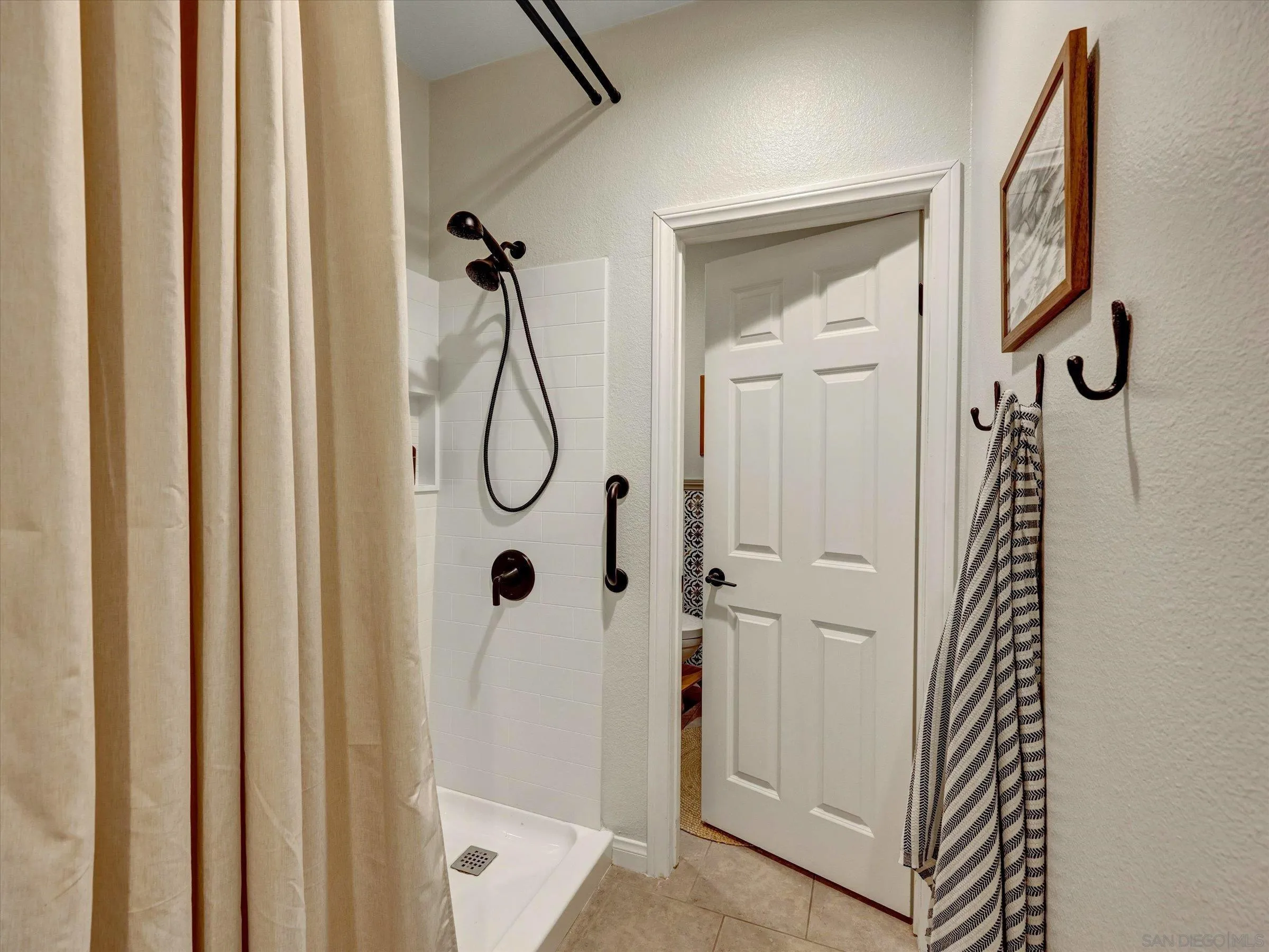 37244 Avocet Way Murrieta, CA 92563 - Photo 8 of 71 a bathroom with a glass shower door