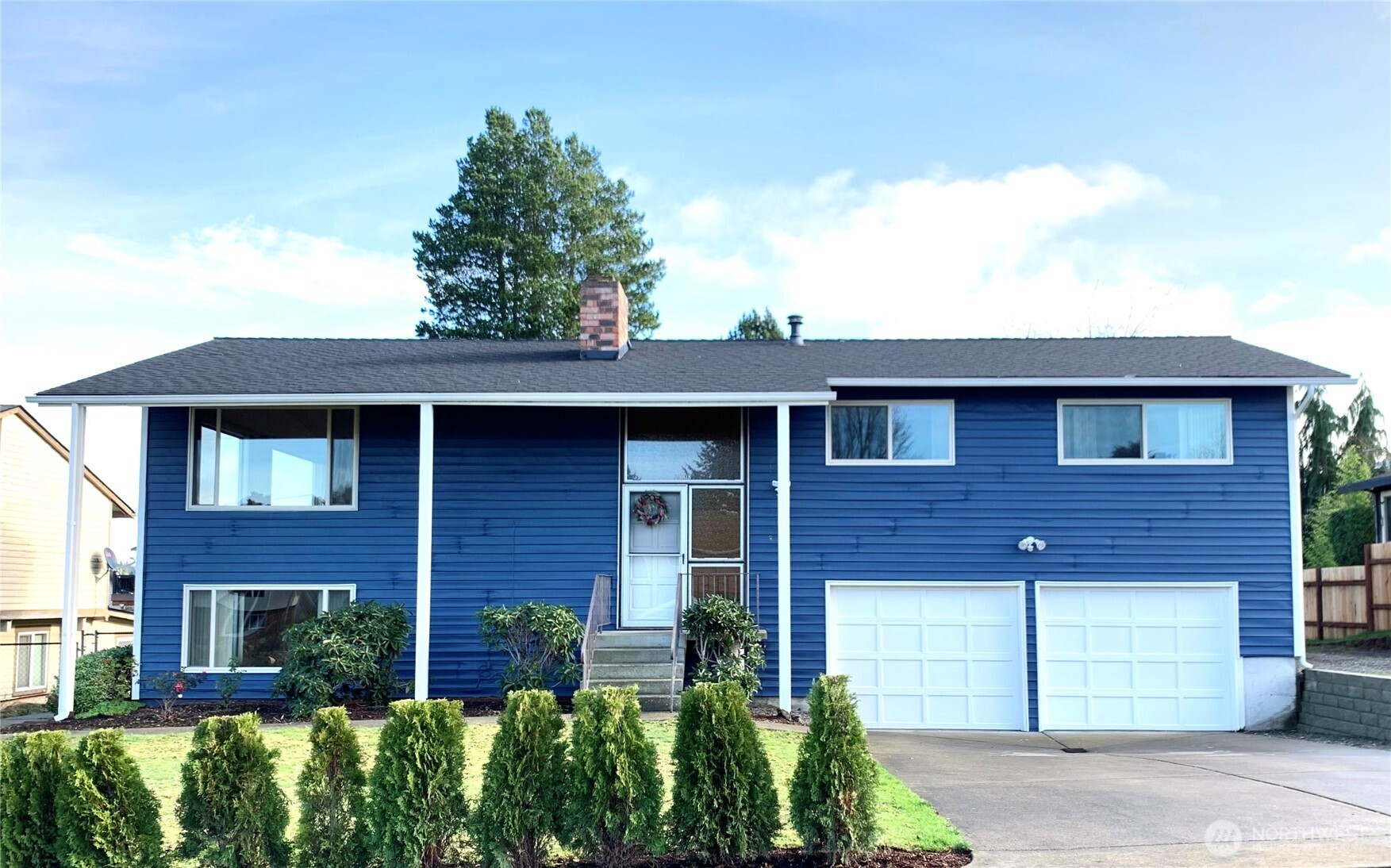 29818 4th Avenue Southwest Federal Way, WA 98023 - Photo 1 of 40 a front view of a house with a garden